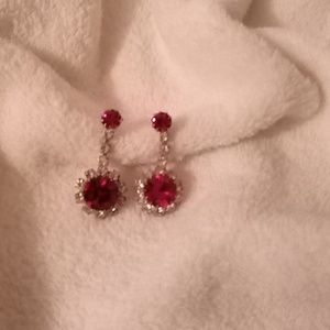 Red and silver earrings.